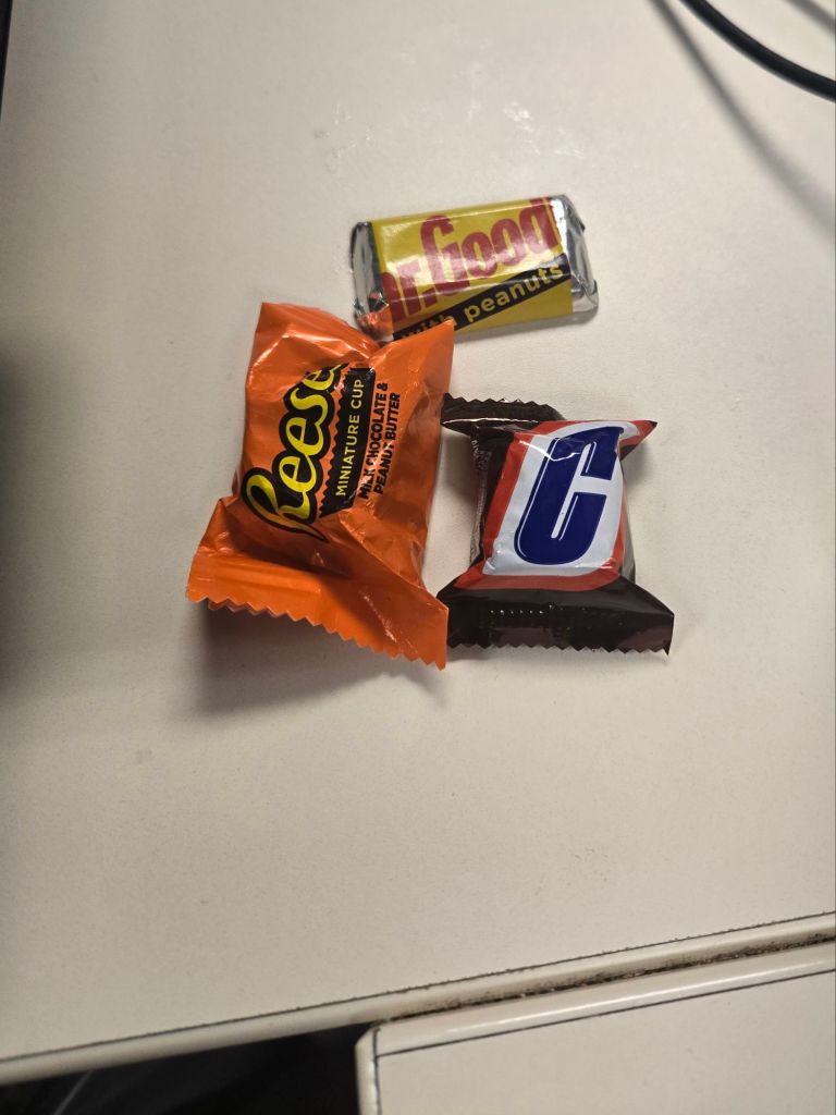 A Snickers, Reese's cup, and Mr. Goodbar, all mini-sized.