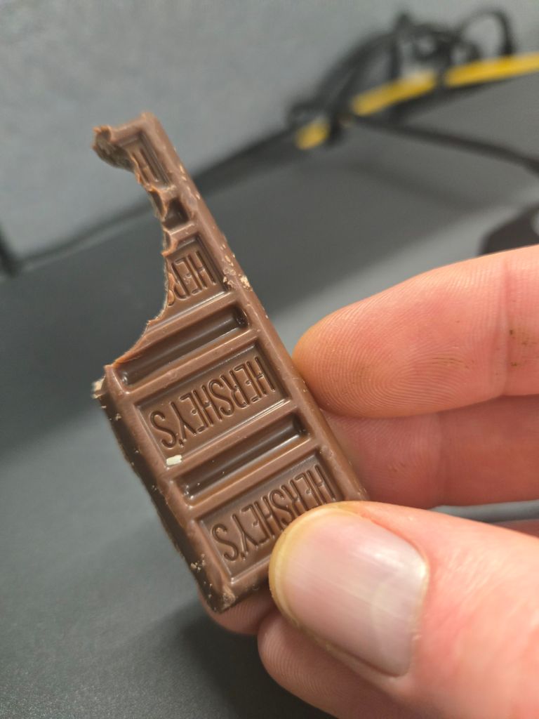 A "fun-size" Hershey's chocolate bar showing someone took a big bite out of it instead of breaking off the little pieces, like it's a banana or something, what kind of sicko does that??